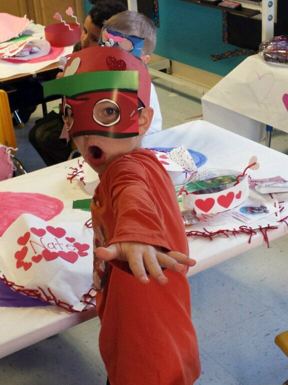 Kindergartener dressed up for Valentine's Day