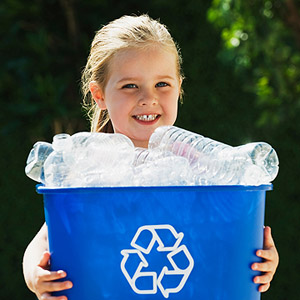 Girl with full recycling bin