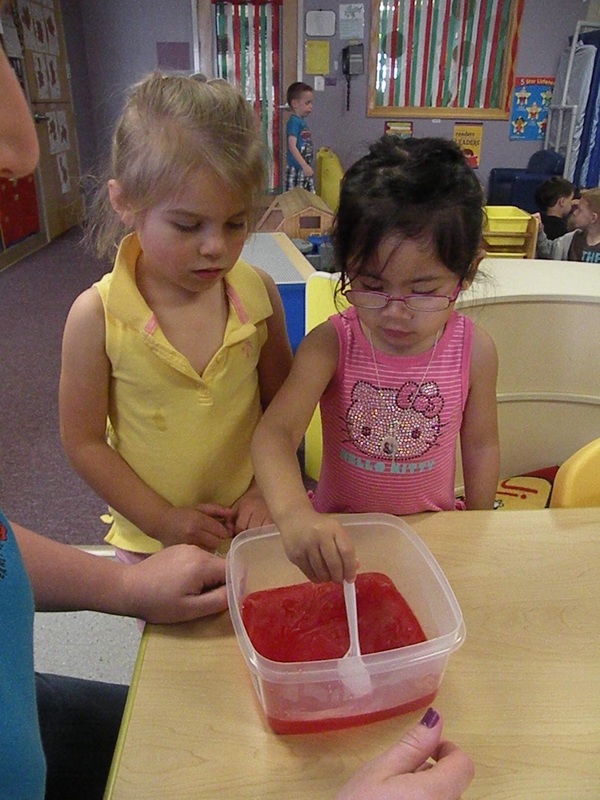 Pre-schoolers mixing jello