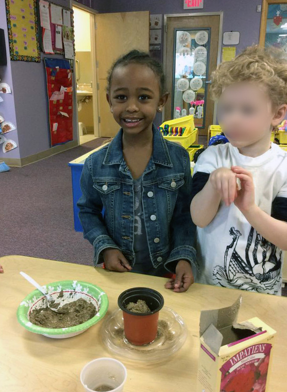 Pre-schoolers helping plant seeds